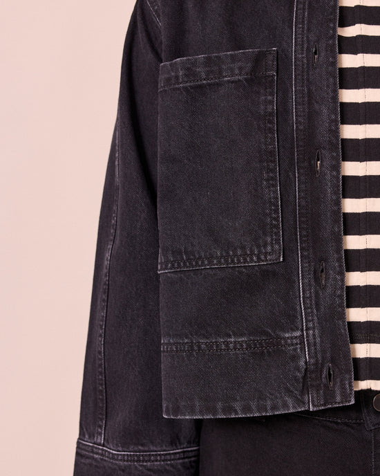 model wears kat washed black denim jacket