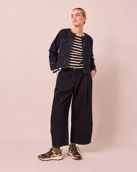 model wears kat washed black denim jacket