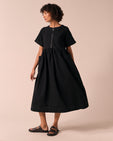 model wears kera black denim dress