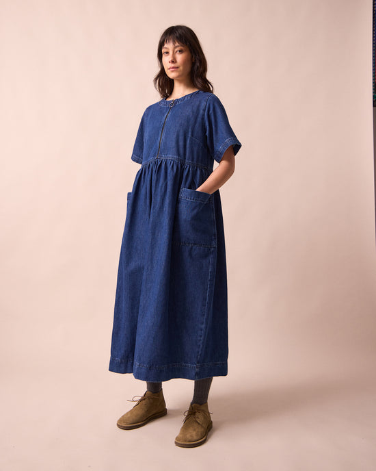 model wears kera mid blue denim dress