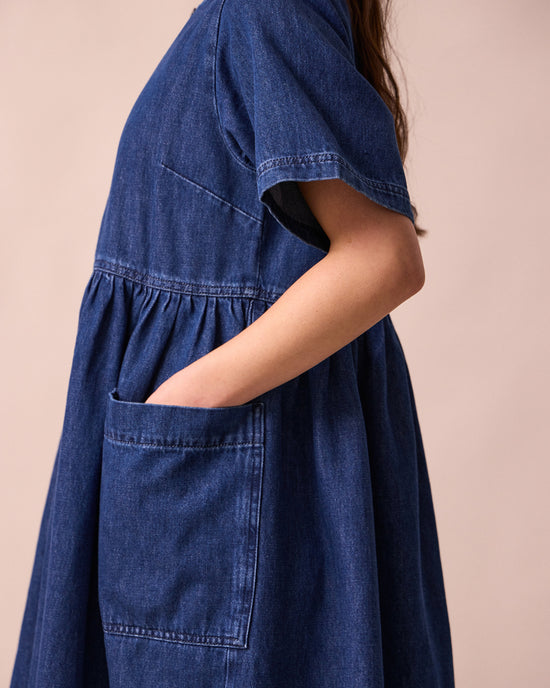 model wears kera mid blue denim dress
