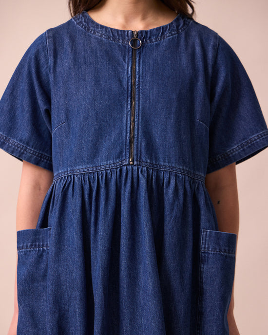 model wears kera mid blue denim dress