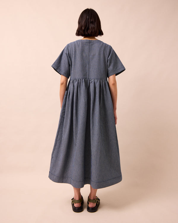 model wears kera navy hickory stripe denim dress