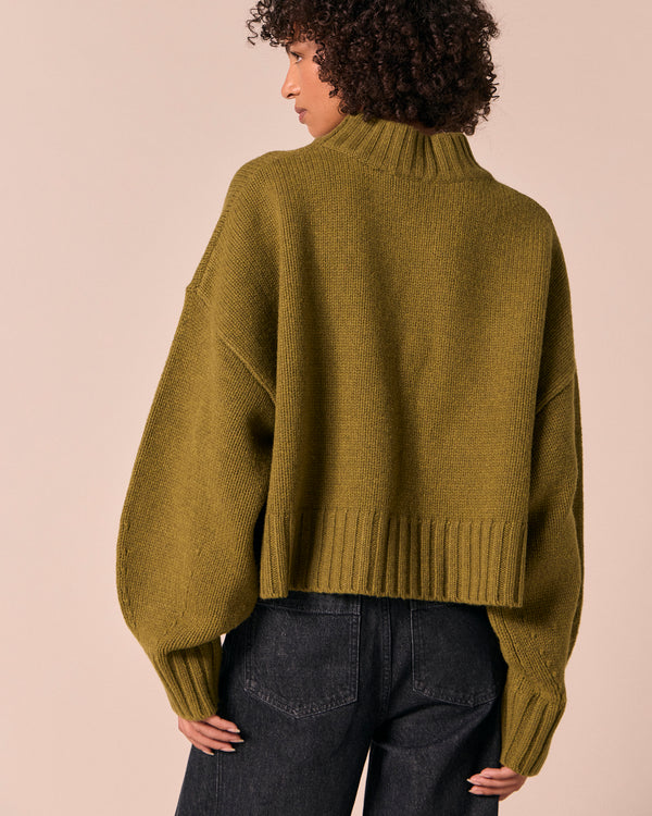 model wears kimi moss green knitted jumper