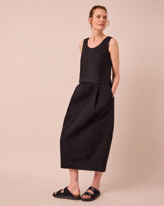 model wears kim black linen top