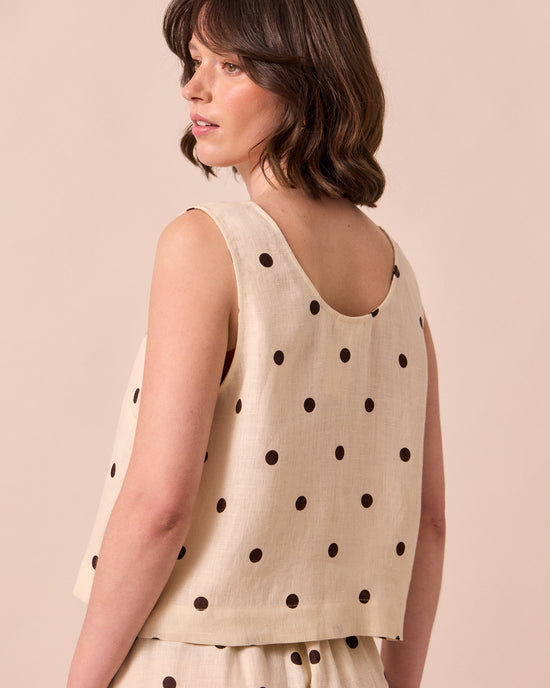 model wears kim bone spot linen top