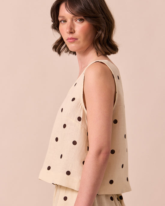 model wears kim bone spot linen top