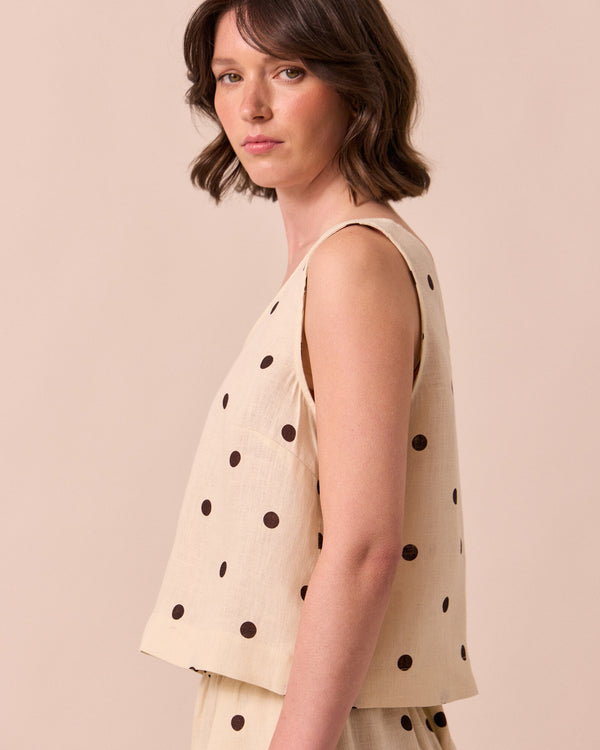 model wears kim bone spot linen top