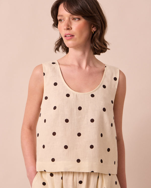 model wears kim bone spot linen top