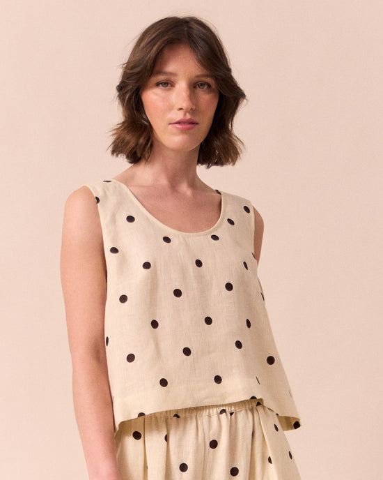 model wears kim bone spot linen top