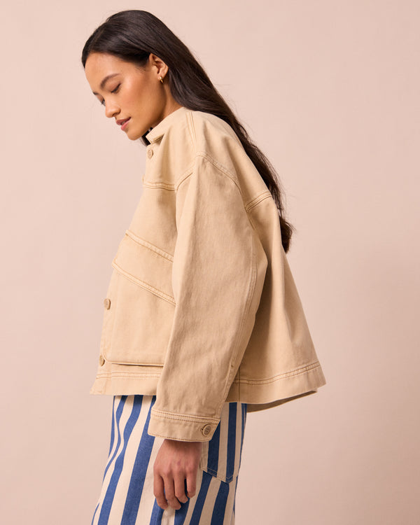 model wears kitty raffia denim jacket