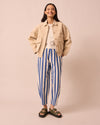 model wears remi ocean stripe denim jeans left
