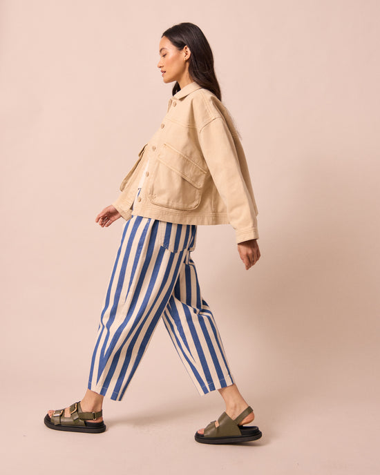 model wears remi ocean stripe denim jeans right