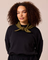 model wears olive knitted neckerchief