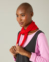 model wears knitted chilli red neckerchief