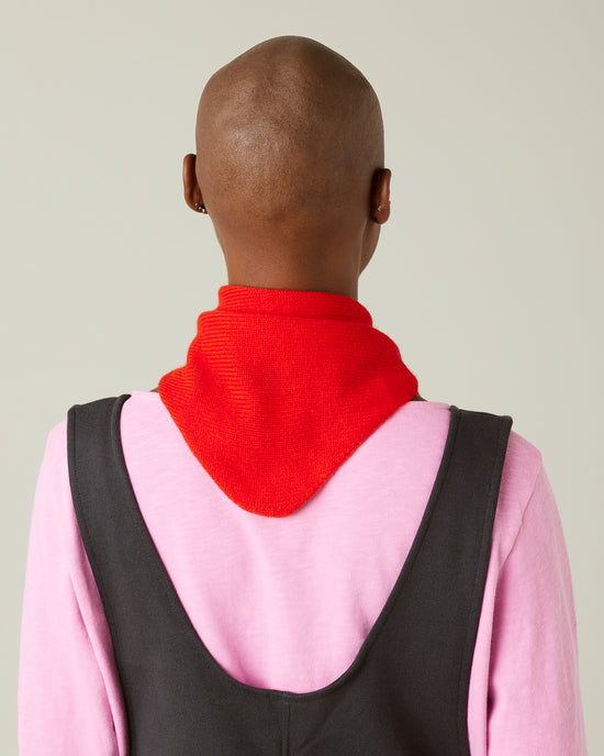 model wears knitted chilli red neckerchief