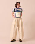 model wears layne bone cotton linen trousers right