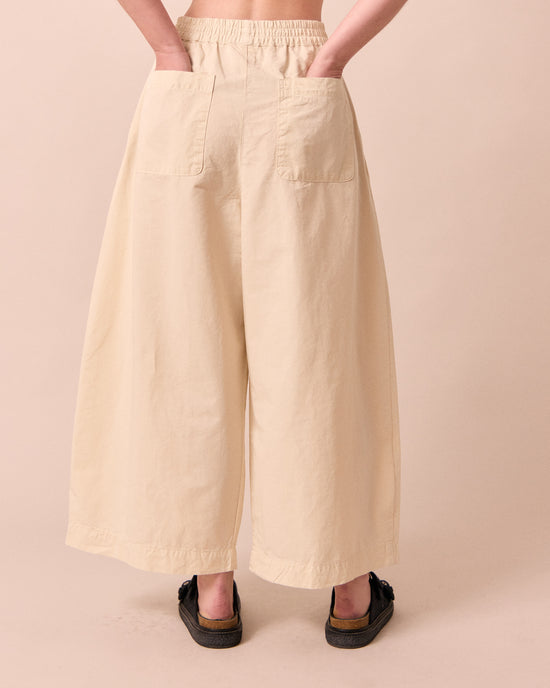 model wears layne bone cotton linen trousers back