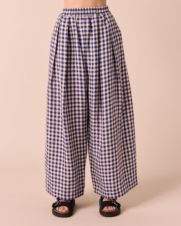 model wears linen indigo gingham layne trousers 