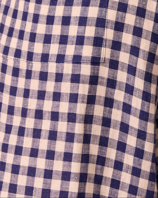 model wears linen indigo gingham layne trousers 