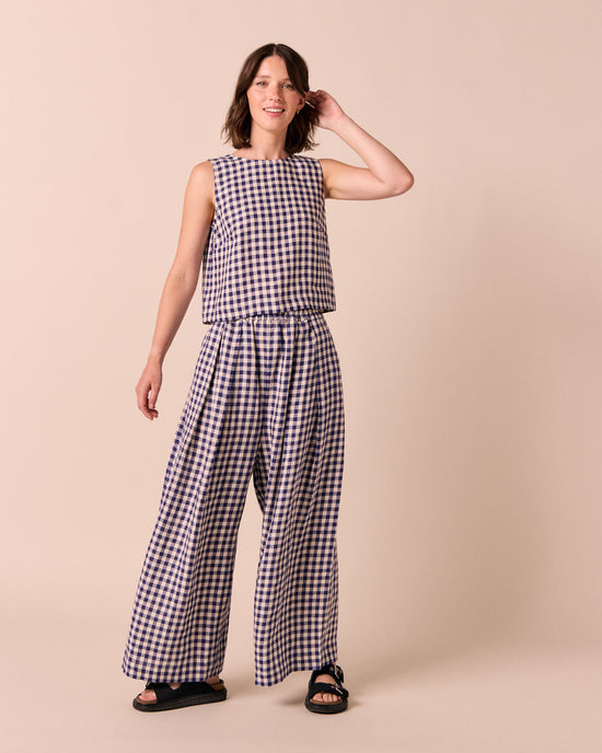 model wears linen indigo gingham layne trousers 