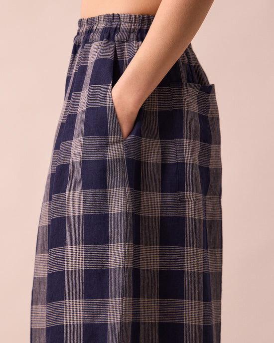 model wears layne navy plaid linen trousers detail