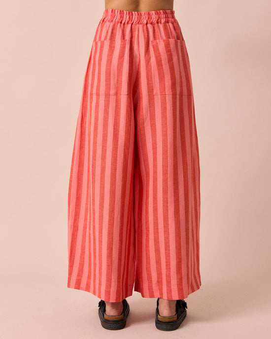 model wears layne sorbet stripe linen trousers back