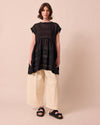 model wears ella black sheer stripe dress