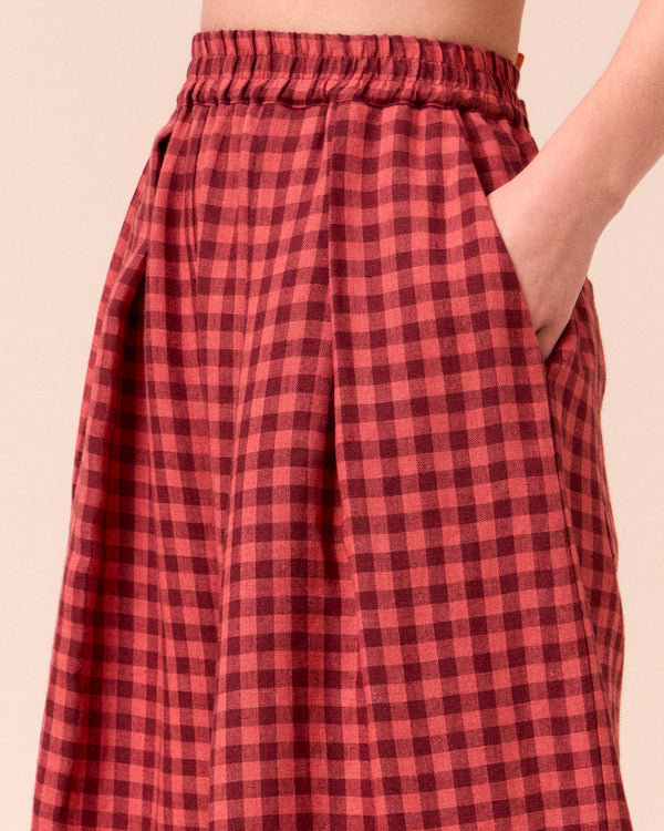 model wears layne deep rose gingham linen trousers