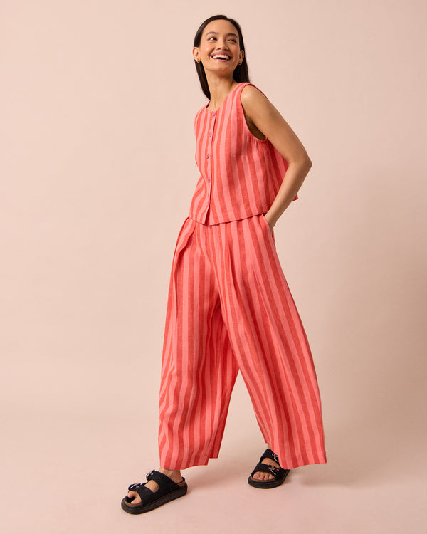model wears layne sorbet stripe linen trousers left