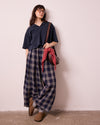 model wears layne navy plaid linen trousers left