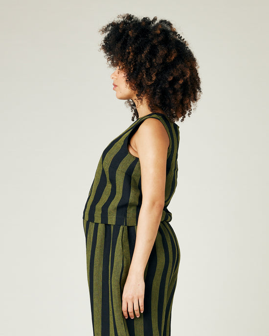 pregnant model wears olive and black stripe linen esme top