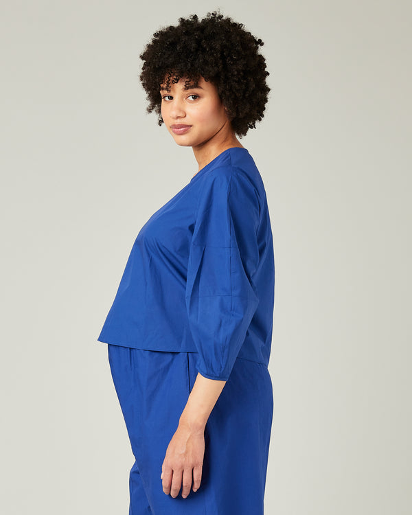 pregnant model wears cobalt poplin lena top