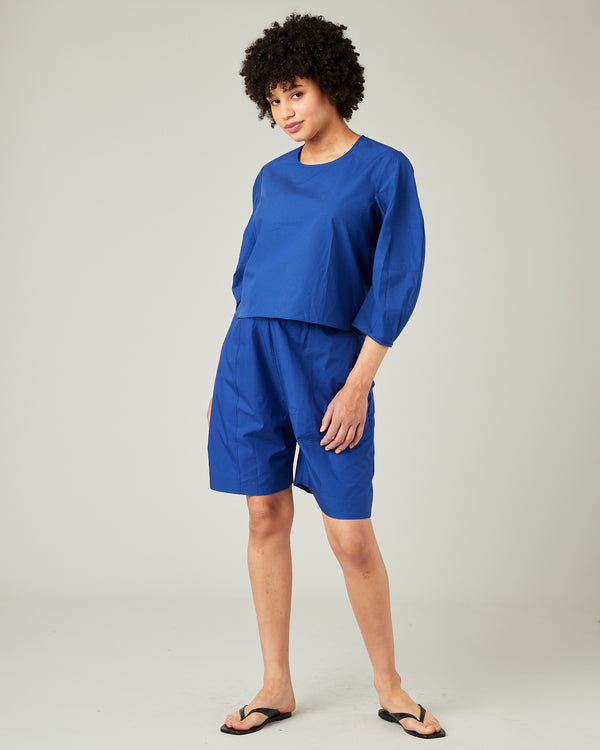 pregnant model wears cobalt poplin lena top