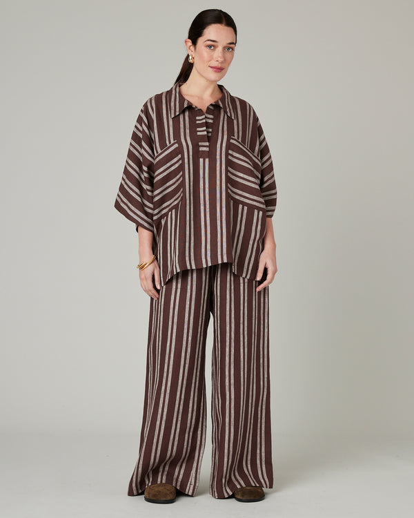 model wears coconut stripe linen lexi trousers