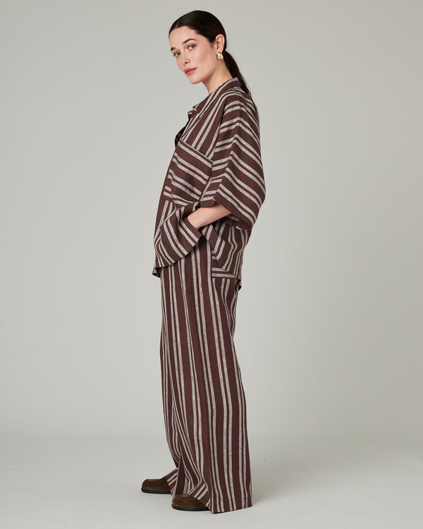 model wears coconut stripe cara linen shirt