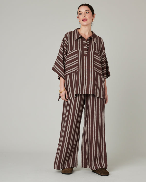 model wears coconut stripe cara linen shirt