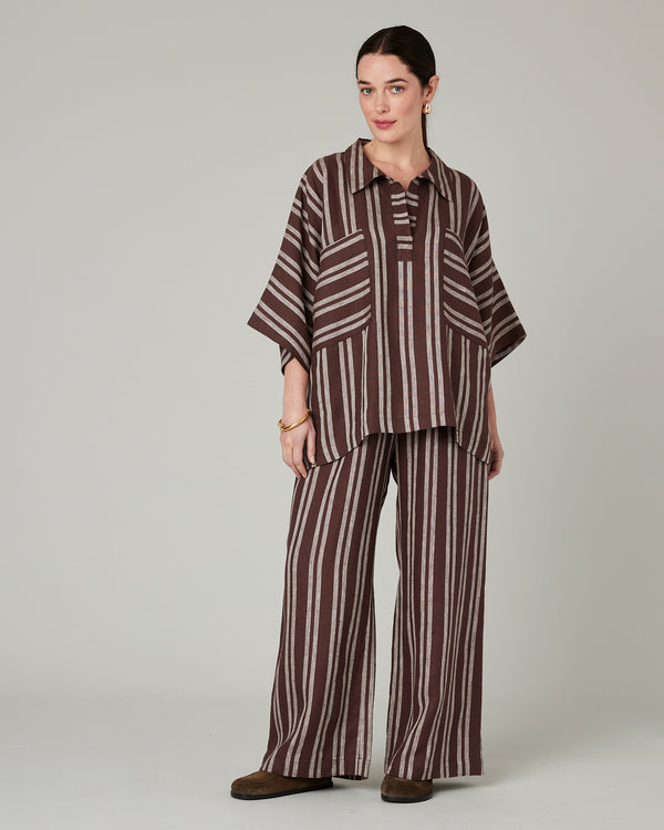 model wears coconut stripe cara linen shirt