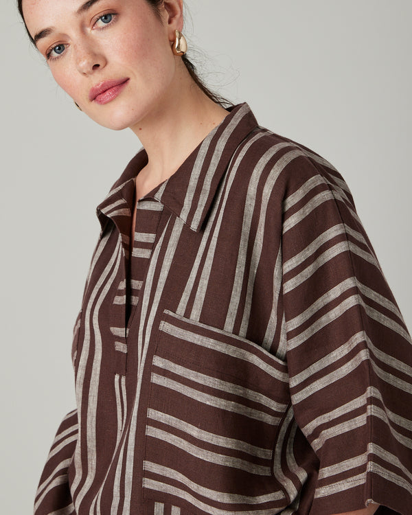 model wears coconut stripe cara linen shirt