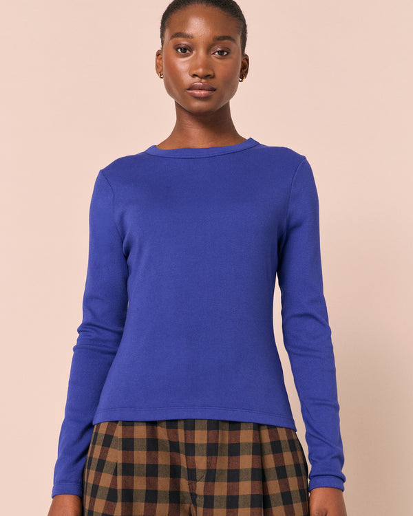 model wears lila klein blue jersey top