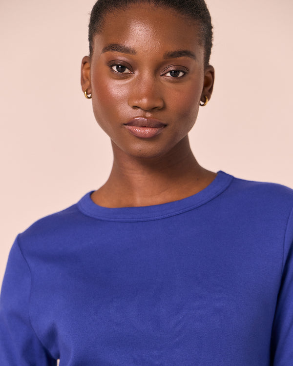 model wears lila klein blue jersey top