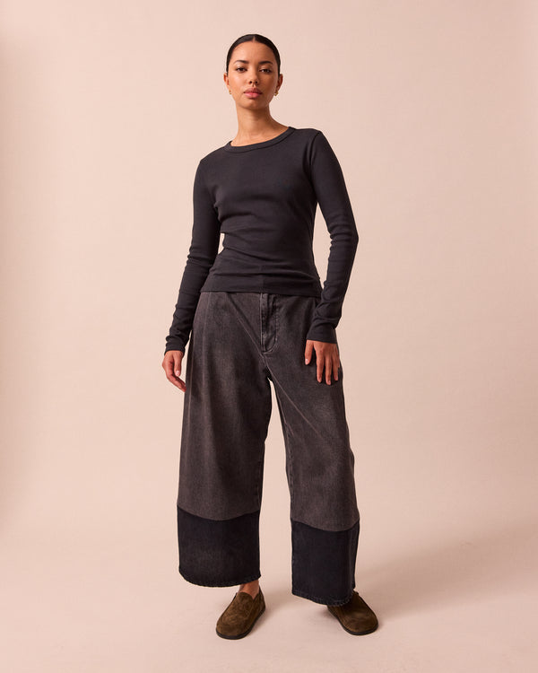 model wears lila black jersey top