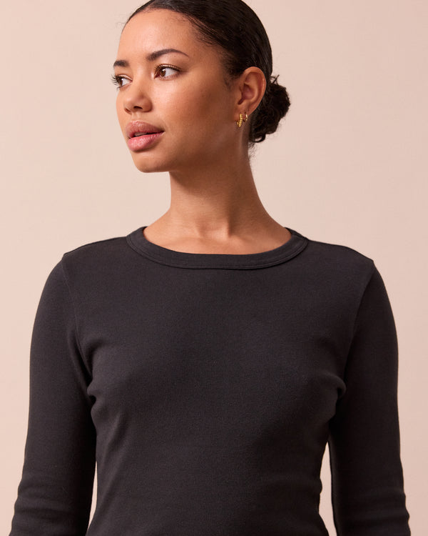 model wears lila black jersey top