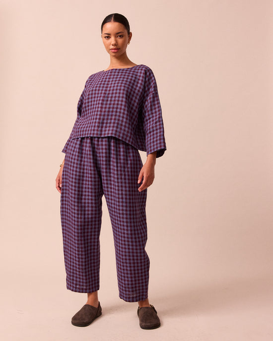 model wears lily blueberry gingham linen top 