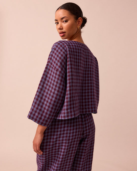 model wears lily blueberry gingham linen top back