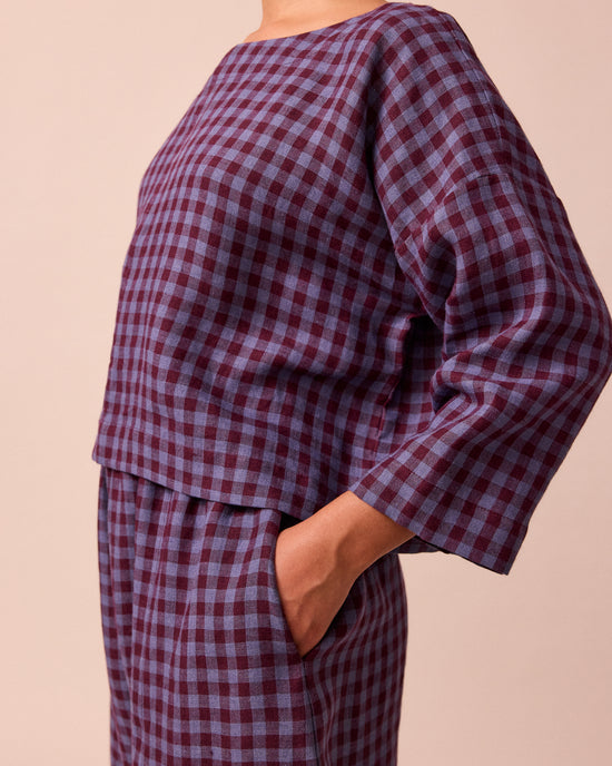 model wears lily blueberry gingham linen top 