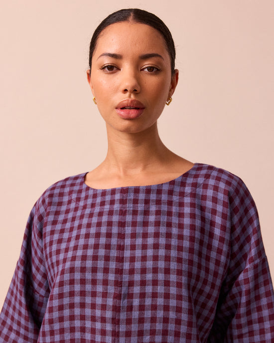 model wears lily blueberry gingham linen top 