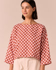 model wears lily rosewood checkerboard linen top