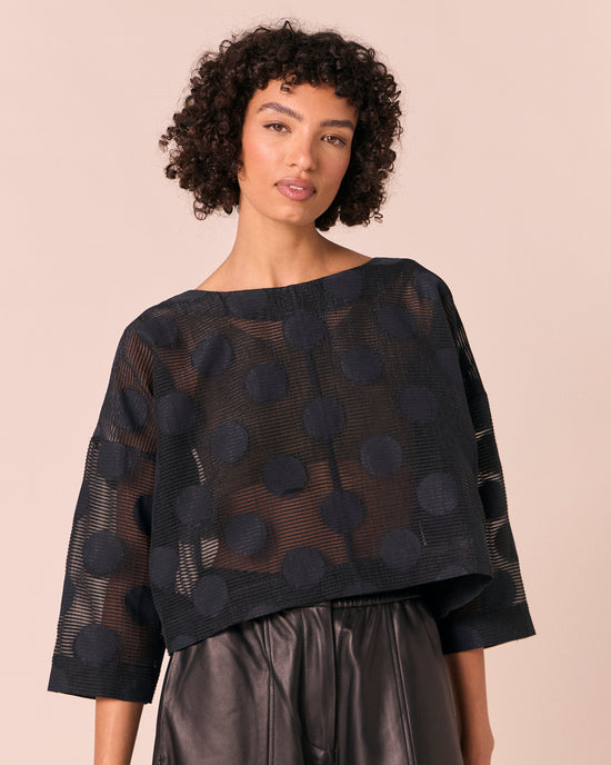 model wears lily black sheer spot top