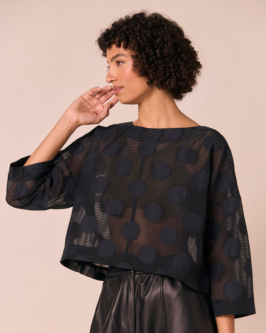 model wears lily black sheer spot top